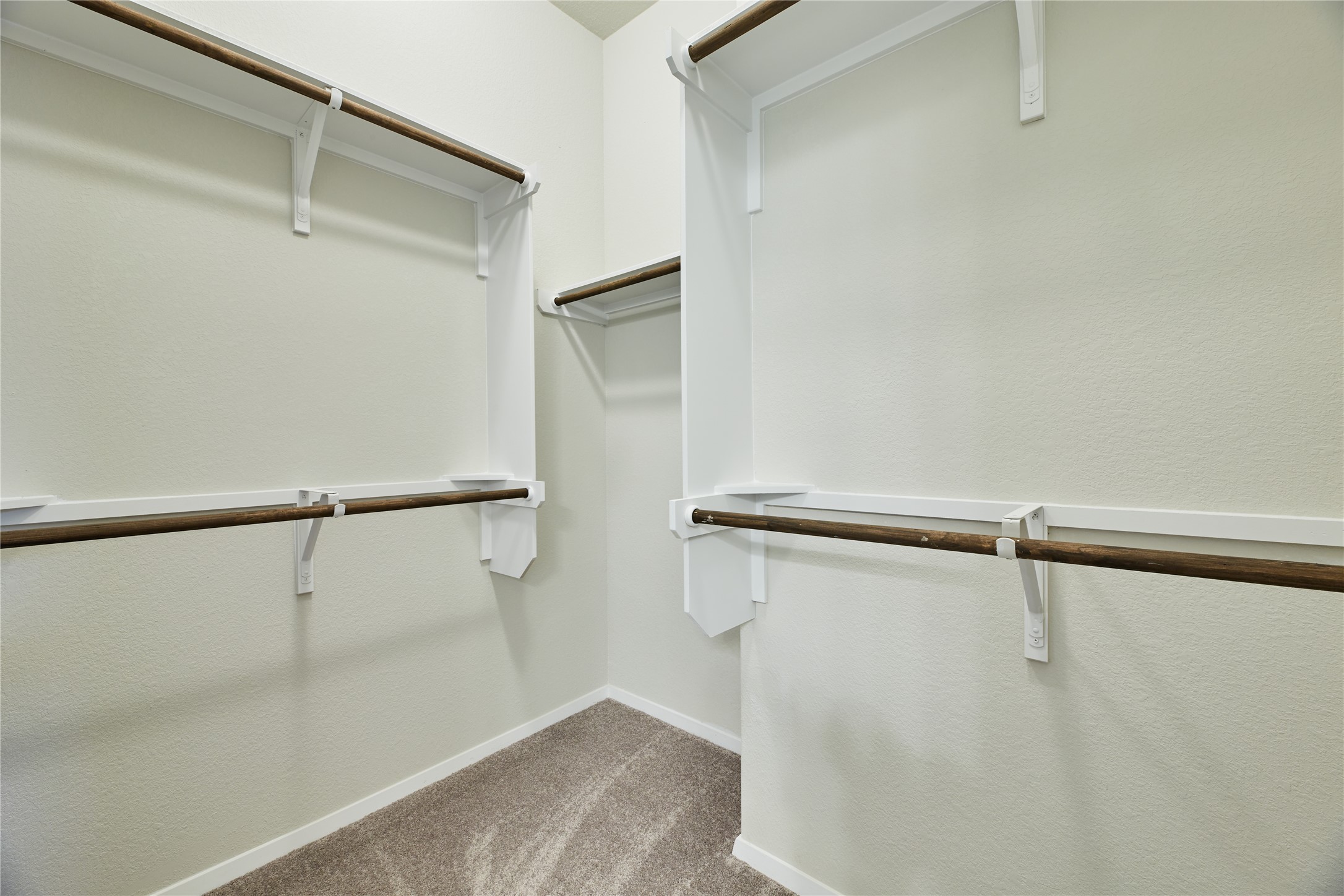 303 Trailside Lane Bastrop, TX 78602 - Photo 12 of 25 Spacious closet with light colored carpet