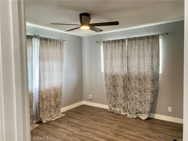 a bathroom with a granite countertop sink a mirror and a shower