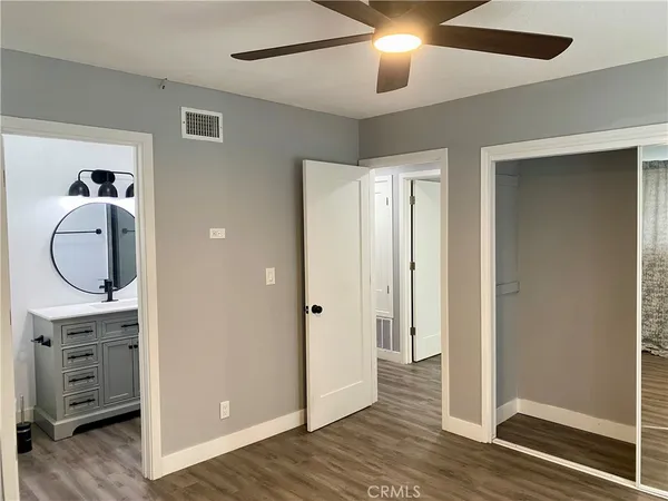 a bathroom with a sink a vanity and a mirror