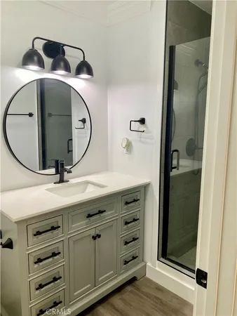a bathroom with a glass shower door