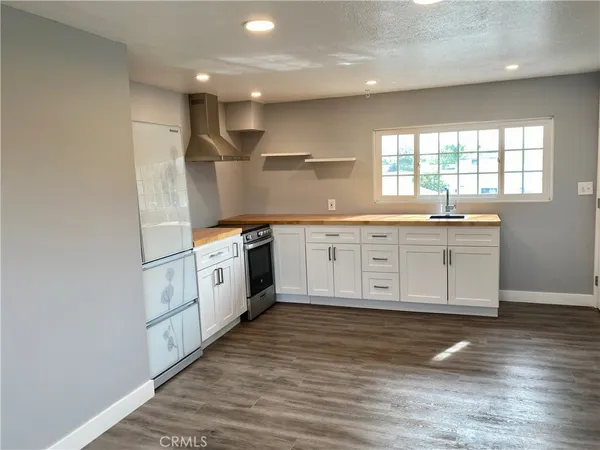 a view of a livingroom with wooden floor