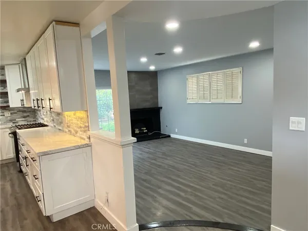 a view of a kitchen cabinets and wooden floor