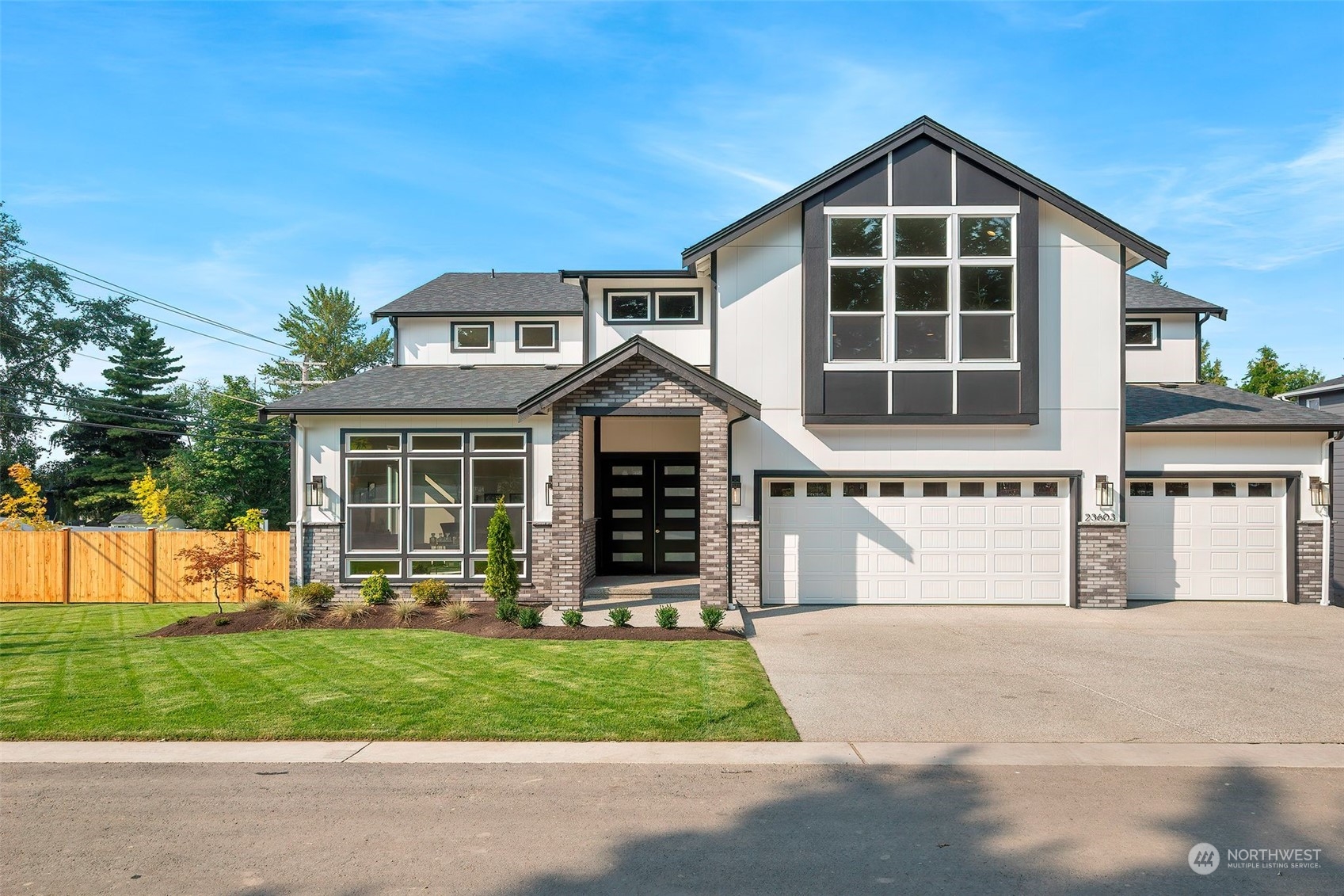 23617 23rd Avenue Southeast Bothell, WA 98021 - Photo 1 of 40 a front view of a house with a yard