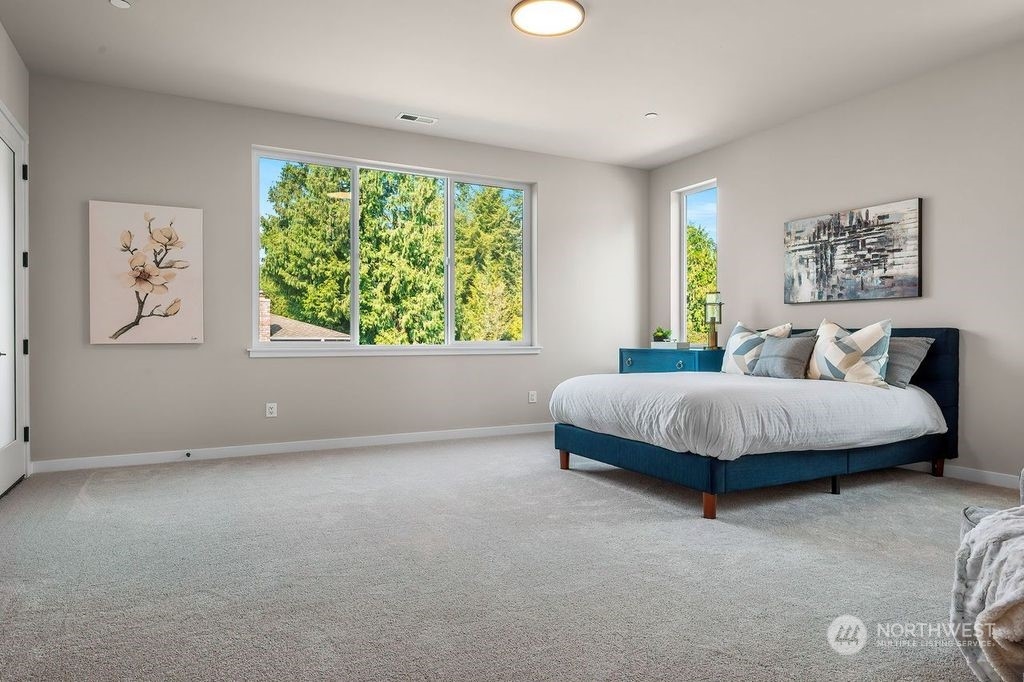 23617 23rd Avenue Southeast Bothell, WA 98021 - Photo 20 of 40 a bedroom with a large bed and a window