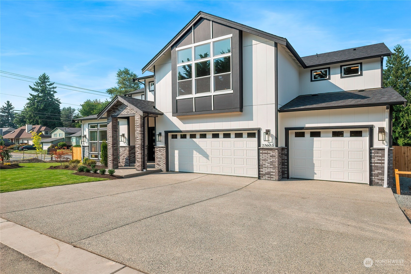 23617 23rd Avenue Southeast Bothell, WA 98021 - Photo 2 of 40 a front view of a house with a yard and garage