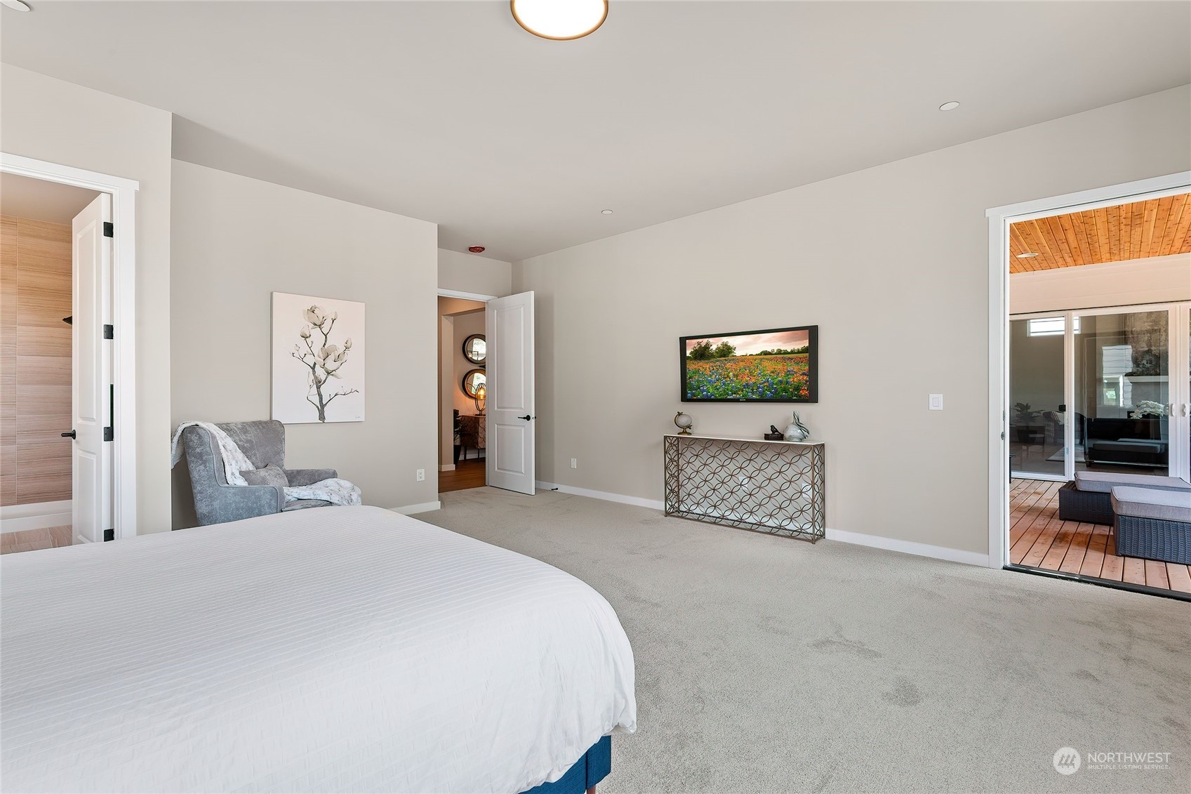 23617 23rd Avenue Southeast Bothell, WA 98021 - Photo 21 of 40 a bedroom with a bed and a flat screen tv