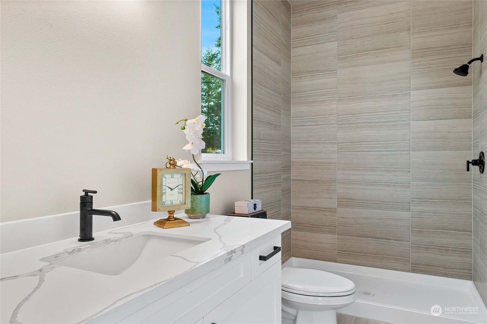 23617 23rd Avenue Southeast Bothell, WA 98021 - Photo 22 of 40 a bathroom with a sink a toilet and shower