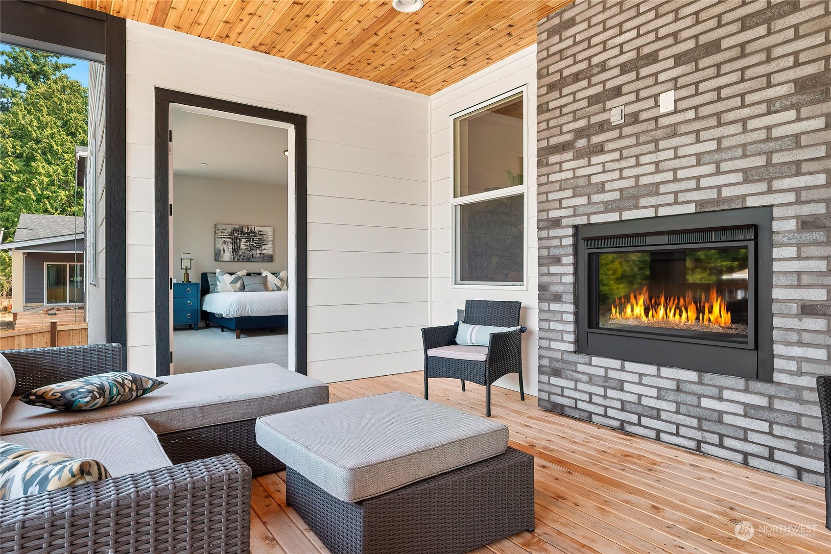 23617 23rd Avenue Southeast Bothell, WA 98021 - Photo 23 of 40 a outdoor living space with furniture and a fireplace