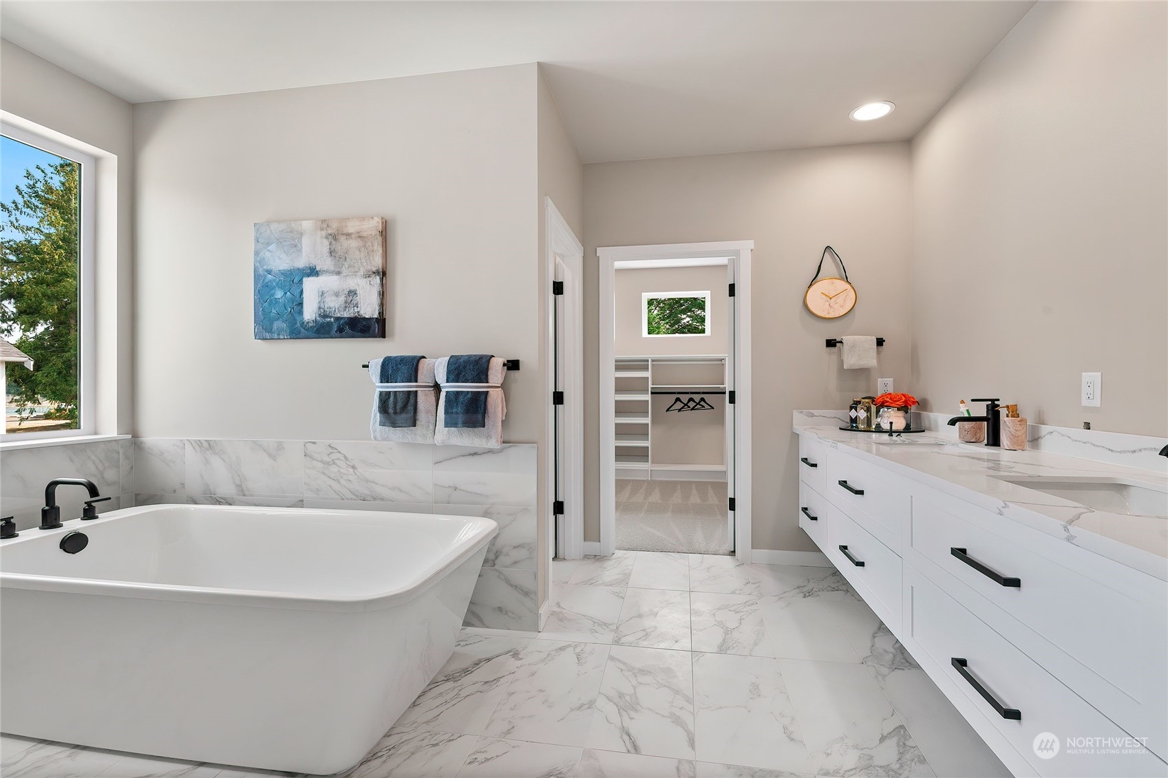 23617 23rd Avenue Southeast Bothell, WA 98021 - Photo 30 of 40 a spacious bathroom with a tub a double vanity sink a mirror and a shower
