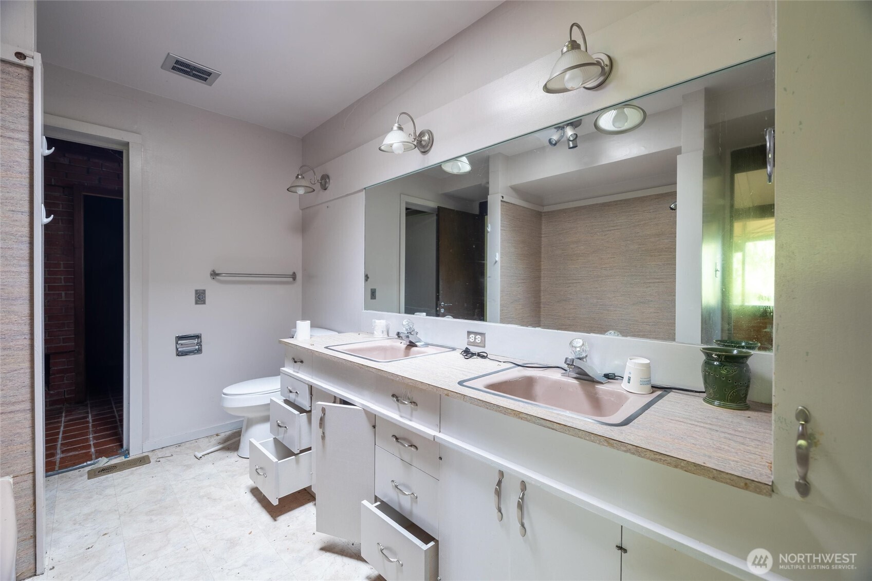 4256 Curtis Road Bellingham, WA 98226 - Photo 18 of 31 a bathroom with a granite countertop sink a toilet and a mirror