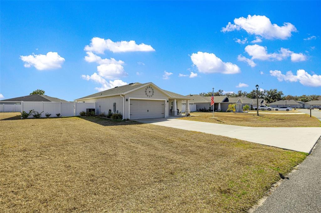 4720 Southeast 89th Place Road Ocala, FL 34480 - Photo 42 of 45 a view of a house with a yard
