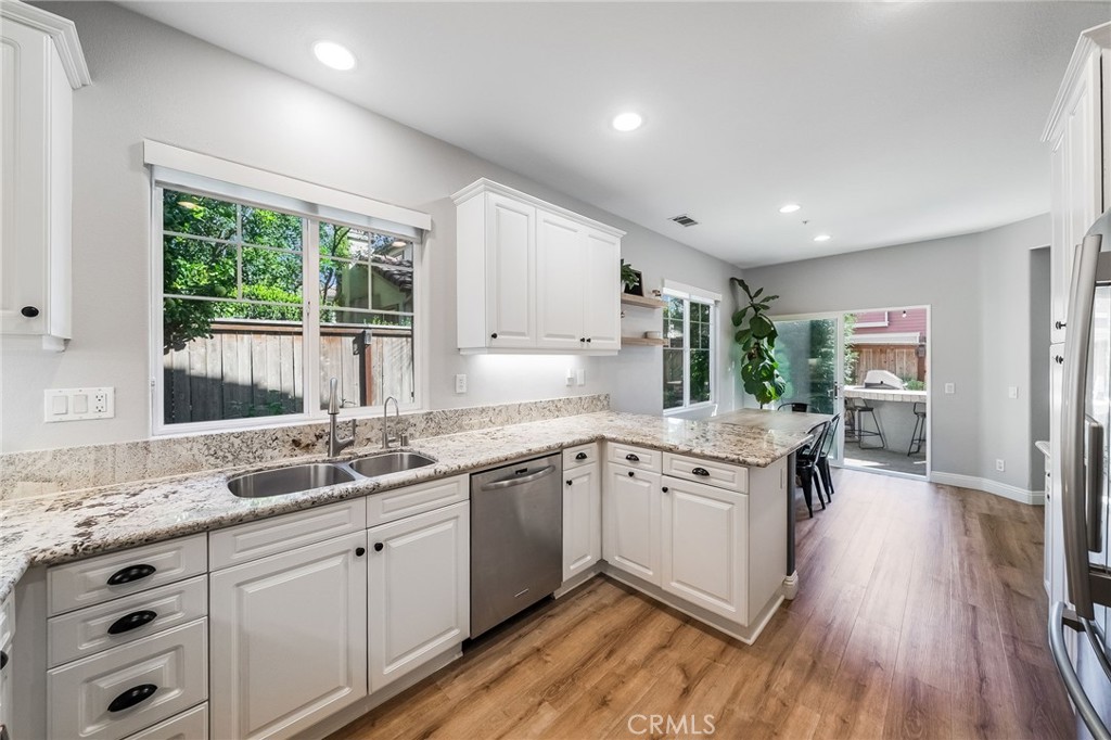 9 Flowerdale Ladera Ranch, CA 92694 - Photo 17 of 54 a kitchen with a sink stove and cabinets