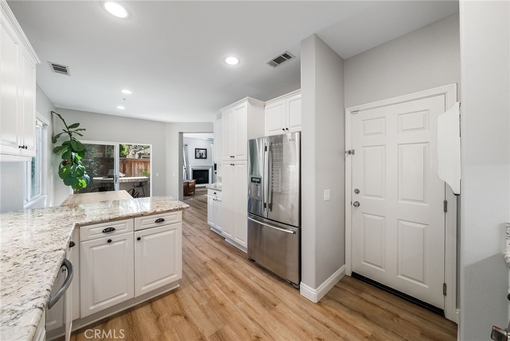 9 Flowerdale Ladera Ranch, CA 92694 - Photo 19 of 54 a kitchen with a refrigerator and a sink