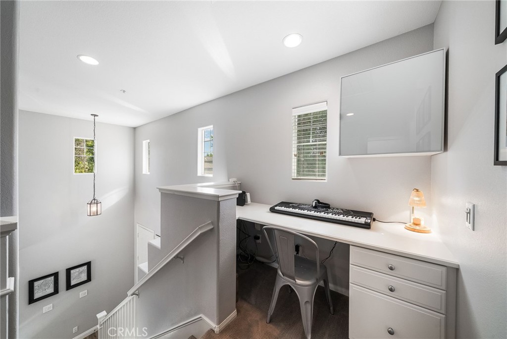 9 Flowerdale Ladera Ranch, CA 92694 - Photo 21 of 54 a kitchen that has a lot of cabinets in it and wooden floors