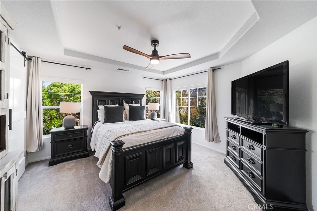 9 Flowerdale Ladera Ranch, CA 92694 - Photo 22 of 54 a bed room with a bed and a television