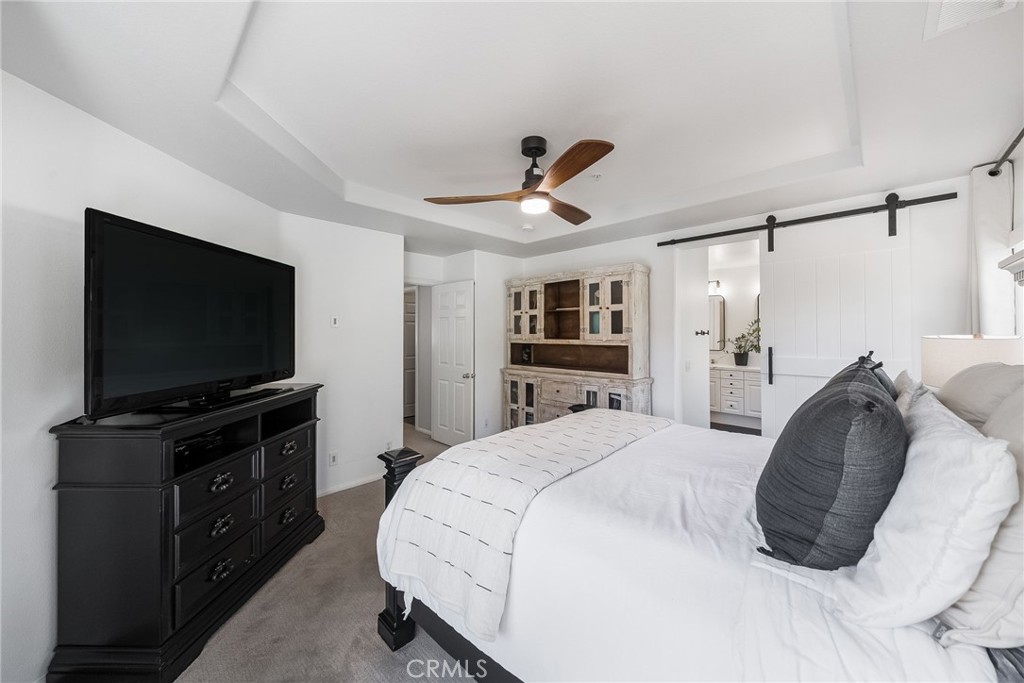 9 Flowerdale Ladera Ranch, CA 92694 - Photo 23 of 54 a bedroom with a bed and a flat screen tv