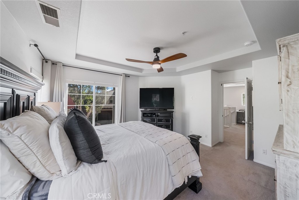 9 Flowerdale Ladera Ranch, CA 92694 - Photo 24 of 54 a bedroom with a bed and a flat screen tv