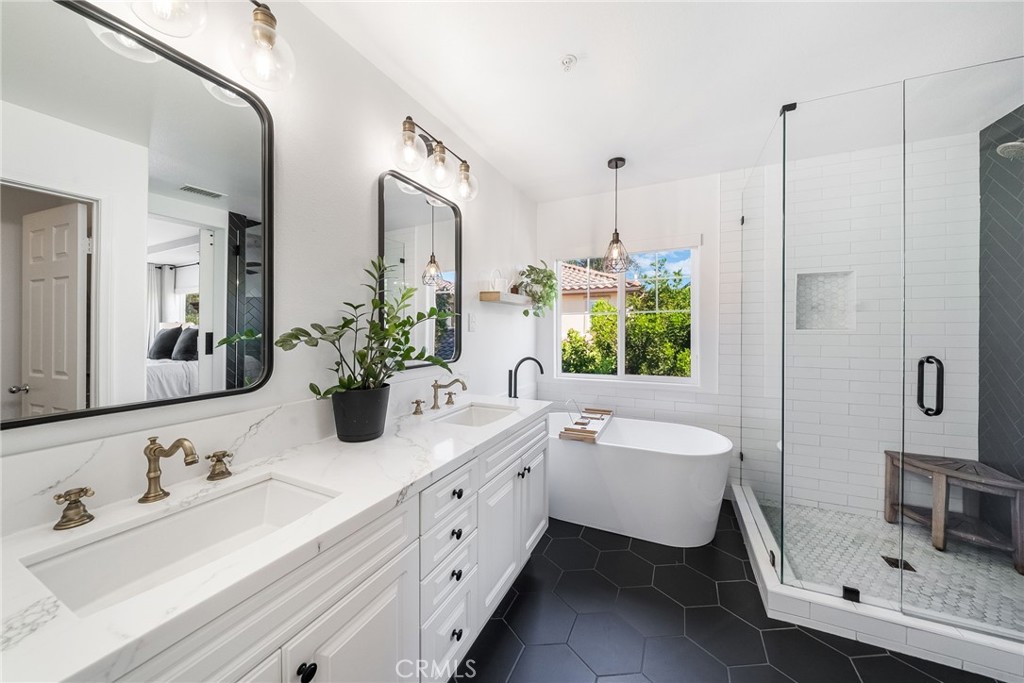 9 Flowerdale Ladera Ranch, CA 92694 - Photo 27 of 54 a bathroom with a double vanity sink mirror and bathtub