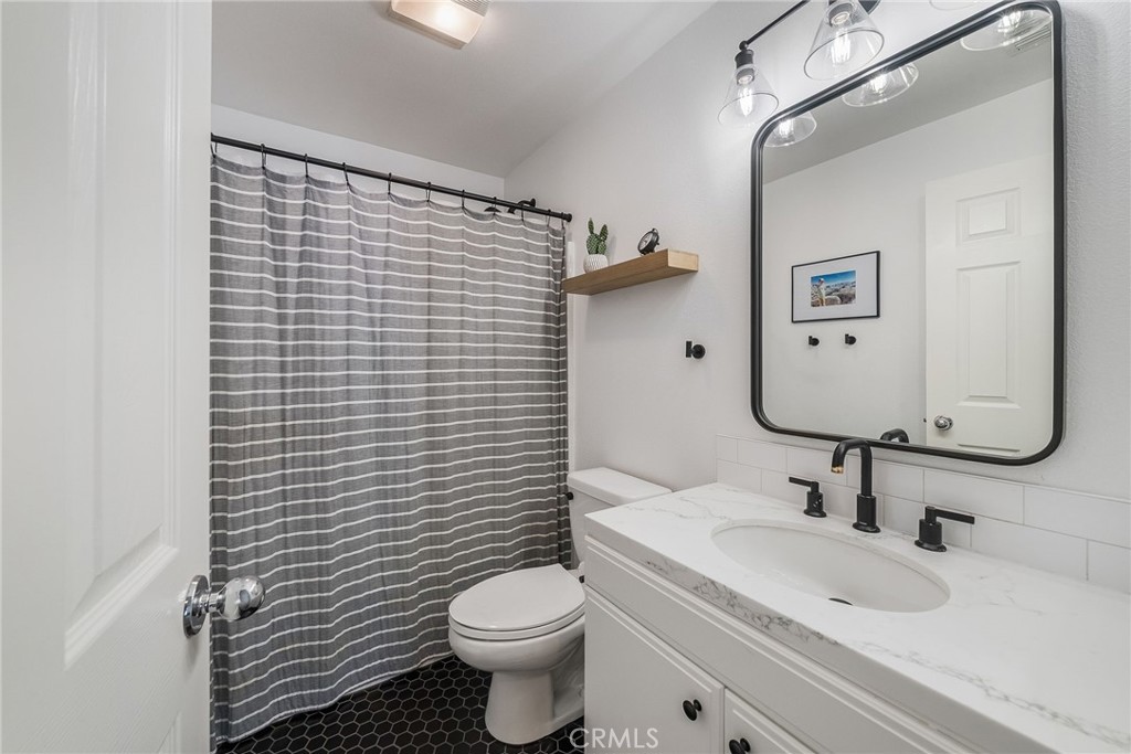 9 Flowerdale Ladera Ranch, CA 92694 - Photo 32 of 54 a bathroom with a toilet sink and mirror
