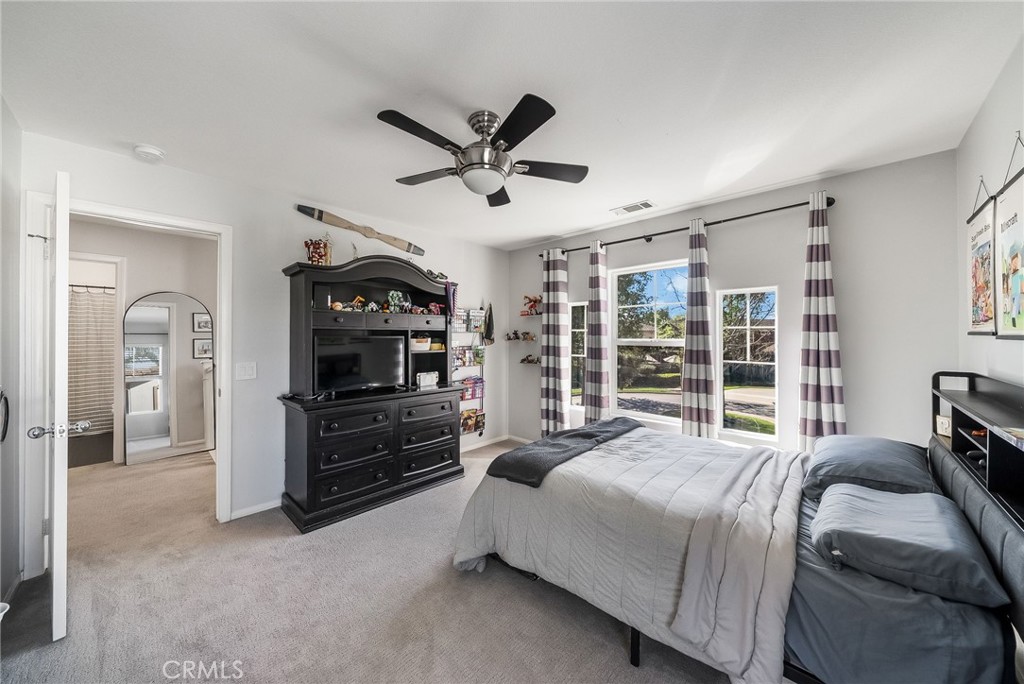 9 Flowerdale Ladera Ranch, CA 92694 - Photo 34 of 54 a bedroom with a bed and a large window