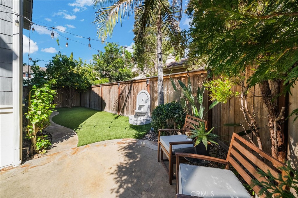 9 Flowerdale Ladera Ranch, CA 92694 - Photo 38 of 54 a backyard of a house with a garden and plants