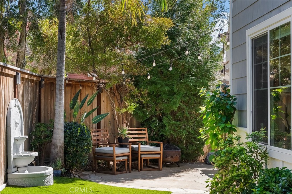 9 Flowerdale Ladera Ranch, CA 92694 - Photo 40 of 54 a view of a chair and table in backyard of the house