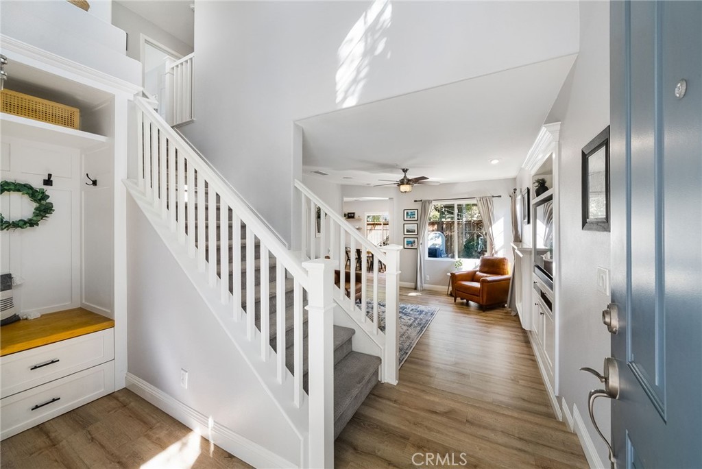9 Flowerdale Ladera Ranch, CA 92694 - Photo 6 of 54 a view of hallway with wooden floor and stairs