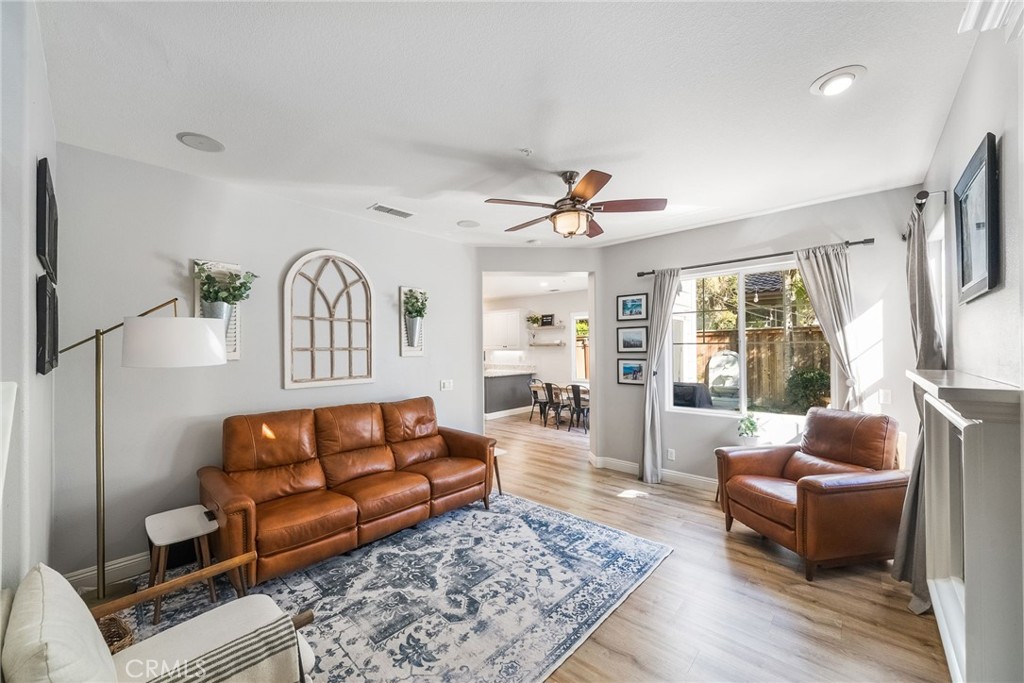 9 Flowerdale Ladera Ranch, CA 92694 - Photo 8 of 54 a living room with furniture ceiling fan and a rug