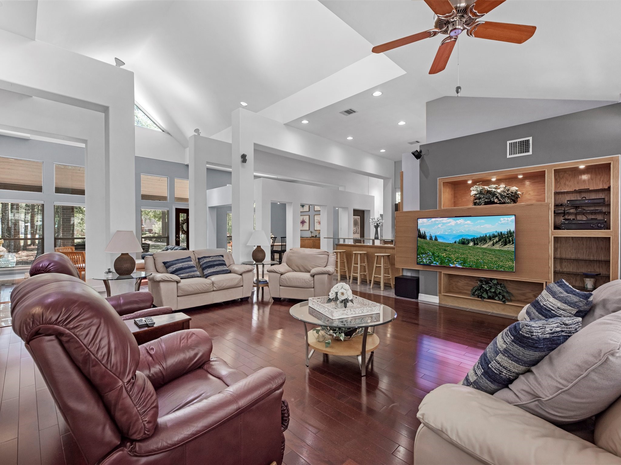 715 Commons Lakeview Drive Huffman, TX 77336 - Photo 12 of 50 a living room with furniture and a flat screen tv