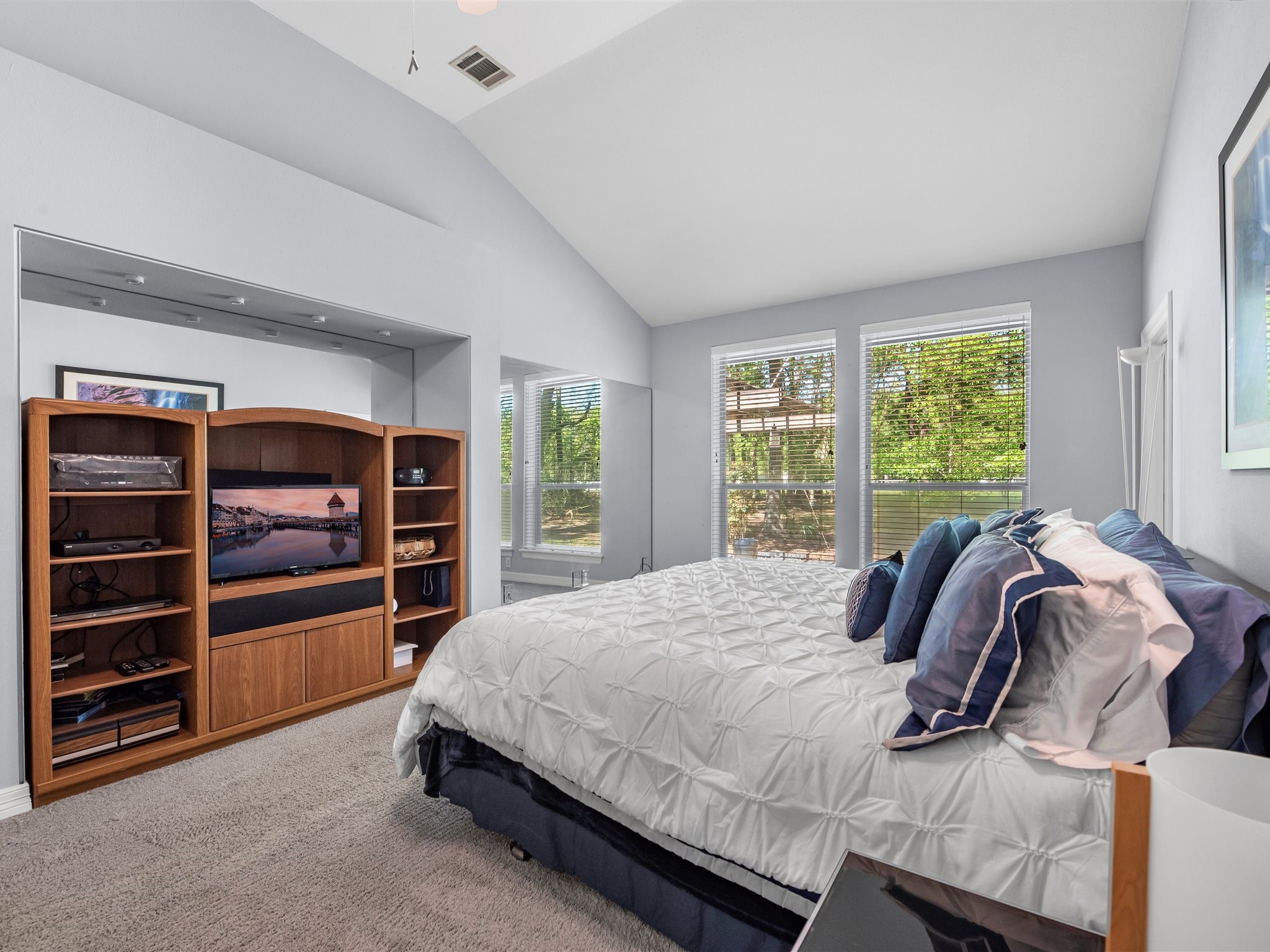 715 Commons Lakeview Drive Huffman, TX 77336 - Photo 29 of 50 a bedroom with a bed and a window