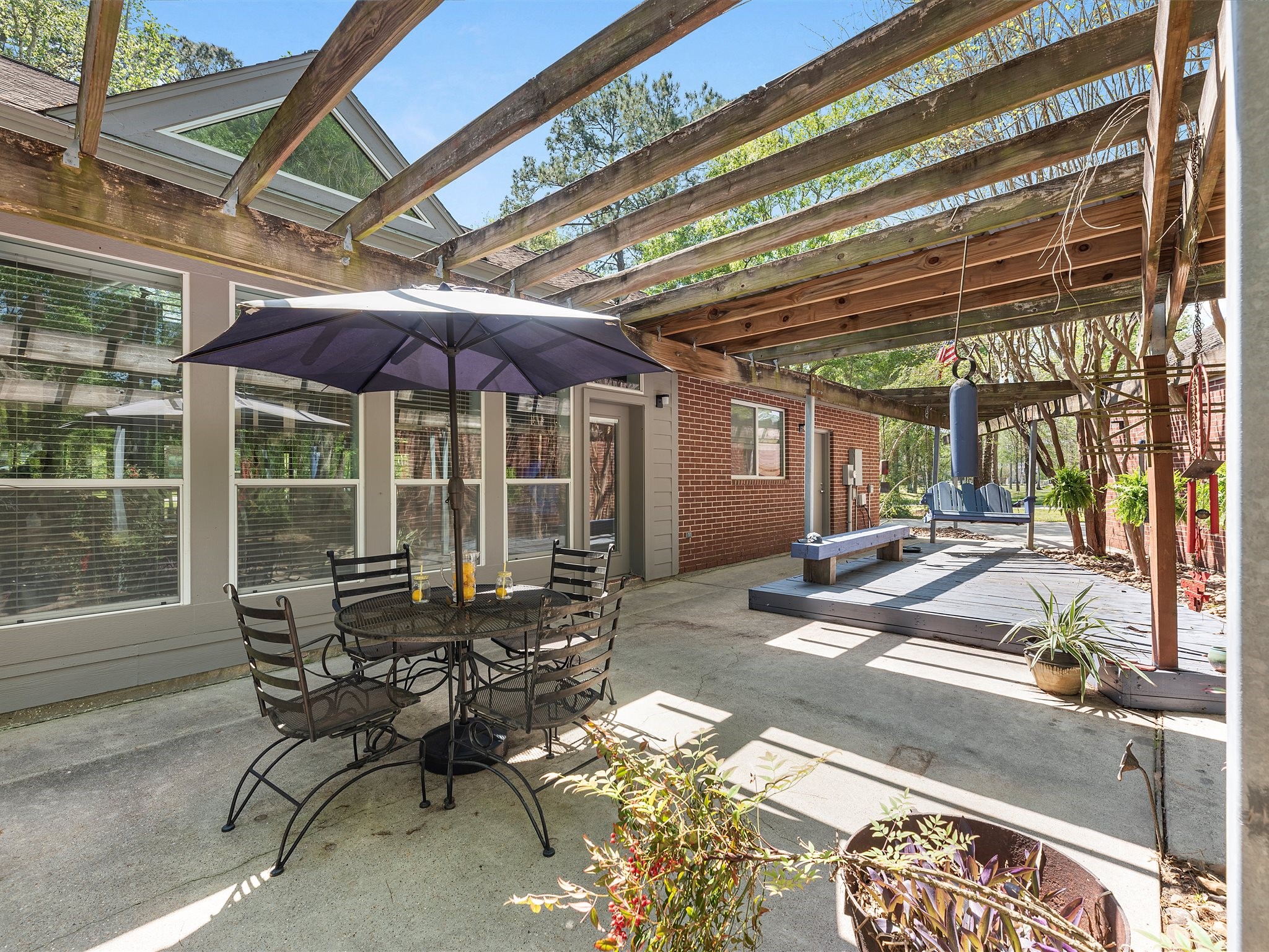 715 Commons Lakeview Drive Huffman, TX 77336 - Photo 42 of 50 a patio with table and chairs