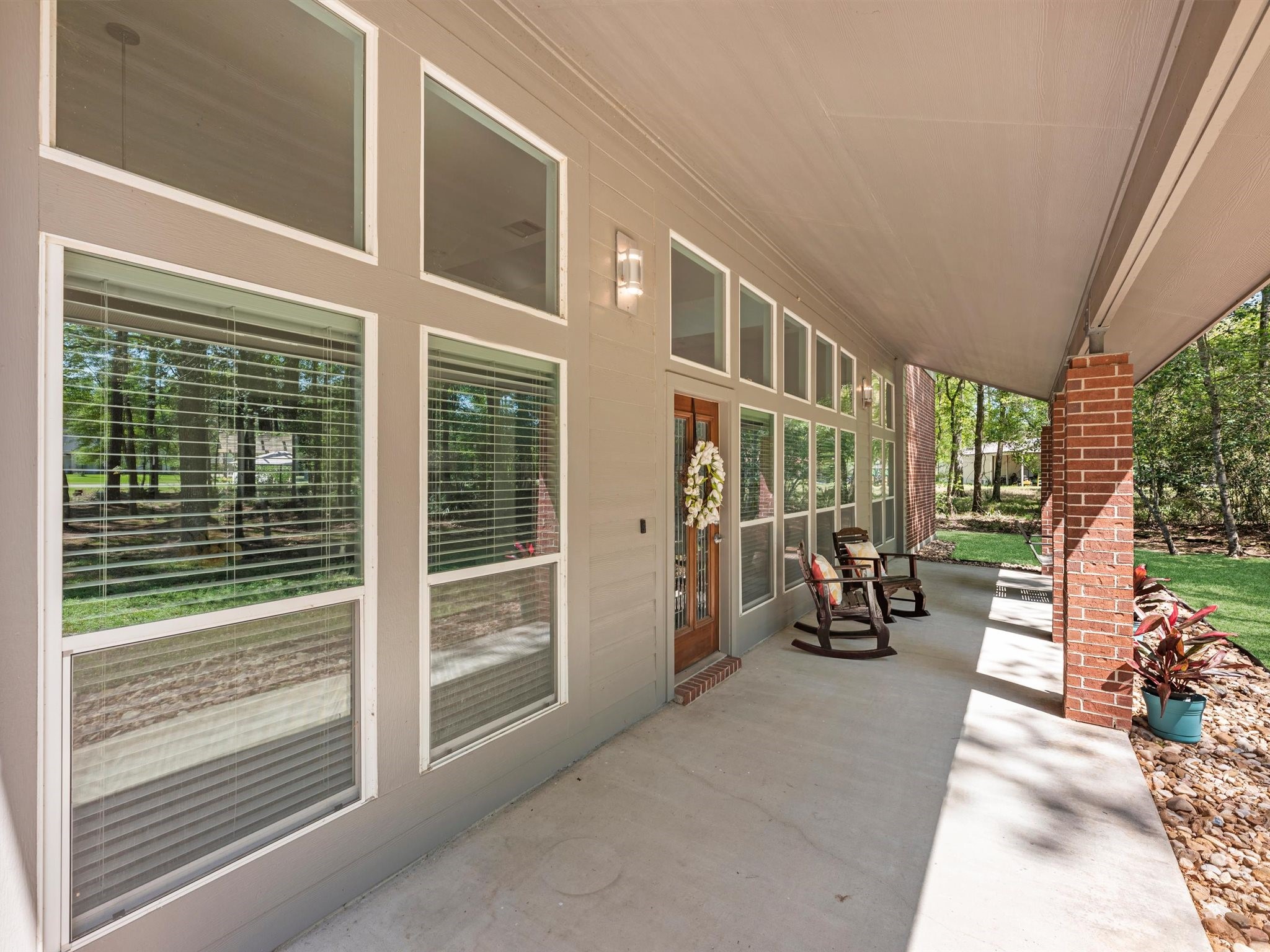 715 Commons Lakeview Drive Huffman, TX 77336 - Photo 5 of 50 a view of a chairs with a porch
