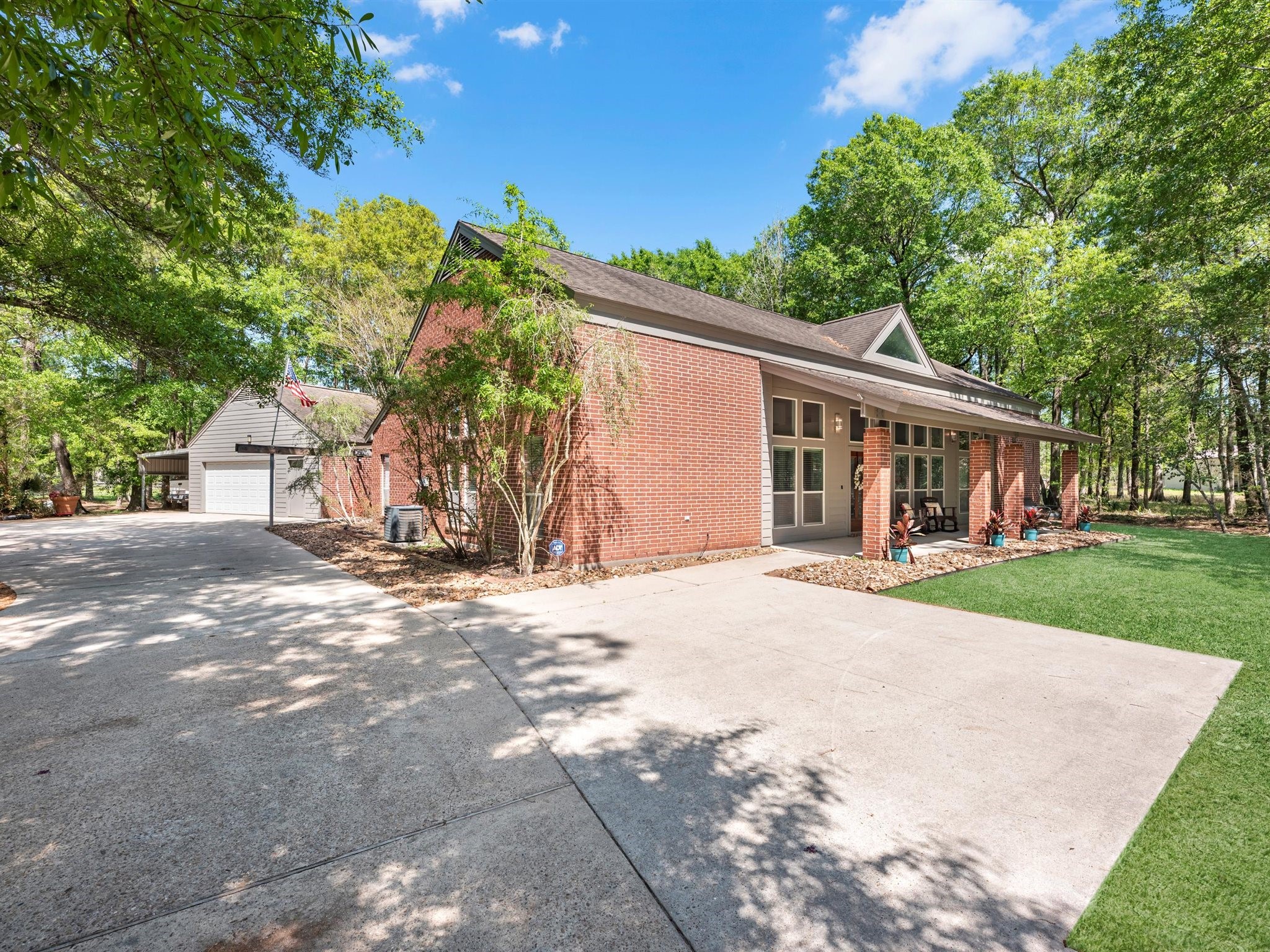 715 Commons Lakeview Drive Huffman, TX 77336 - Photo 6 of 50 a view of a house with a yard and tree s