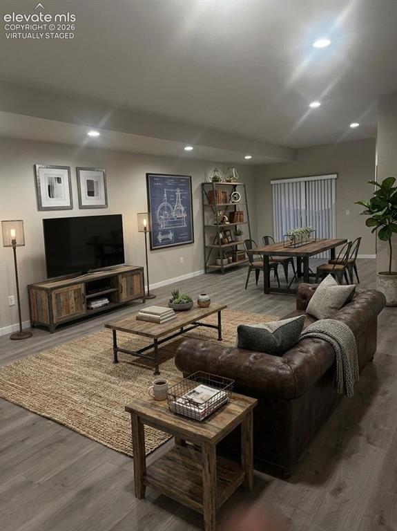 6644 Rawhide Rdg View Colorado Springs, CO 80915 - Photo 6 of 26 a living room with furniture and a flat screen tv