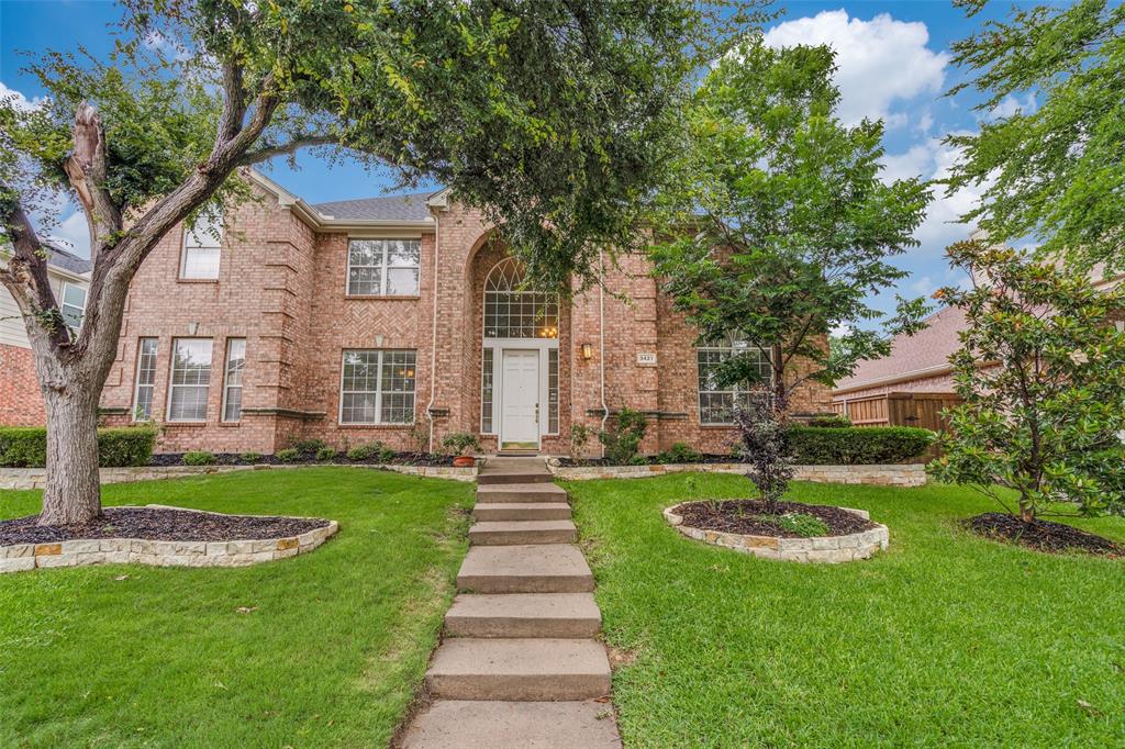 3421 Neiman Road Plano, TX 75025 - Photo 2 of 40 View of front of house with brick siding and a front lawn