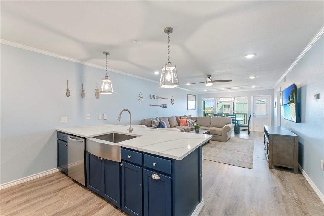 800 Beach Access Road Port Aransas, TX 78373 - Photo 1 of 13 a large kitchen with a sink a counter space and stainless steel appliances