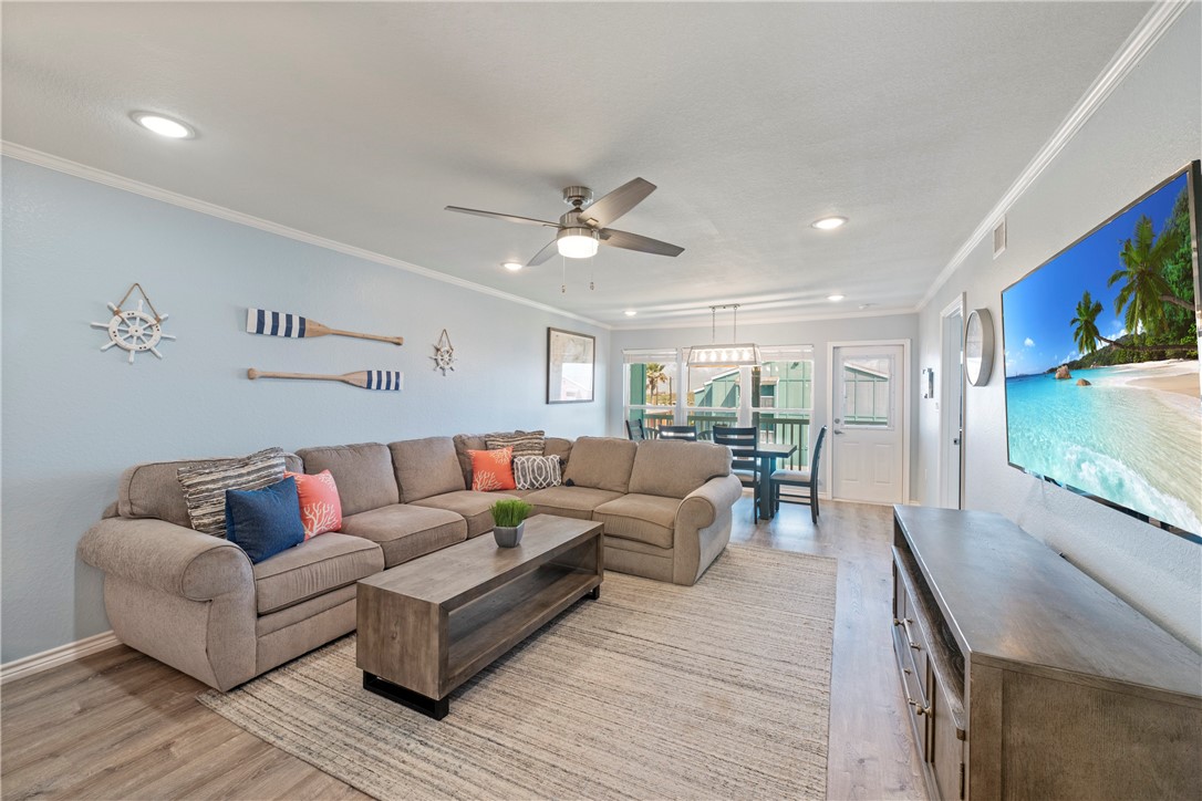 800 Beach Access Road Port Aransas, TX 78373 - Photo 3 of 13 a living room with furniture and a flat screen tv