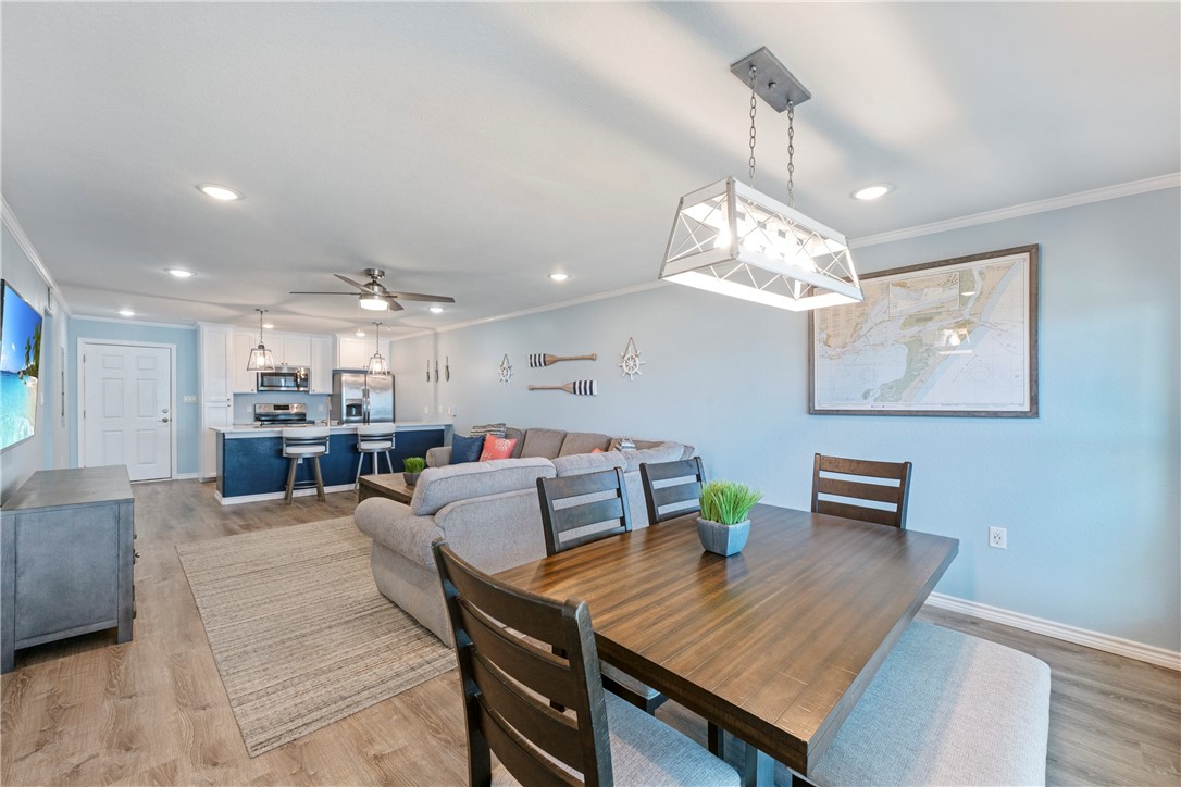 800 Beach Access Road Port Aransas, TX 78373 - Photo 4 of 13 a living room with furniture and a chandelier