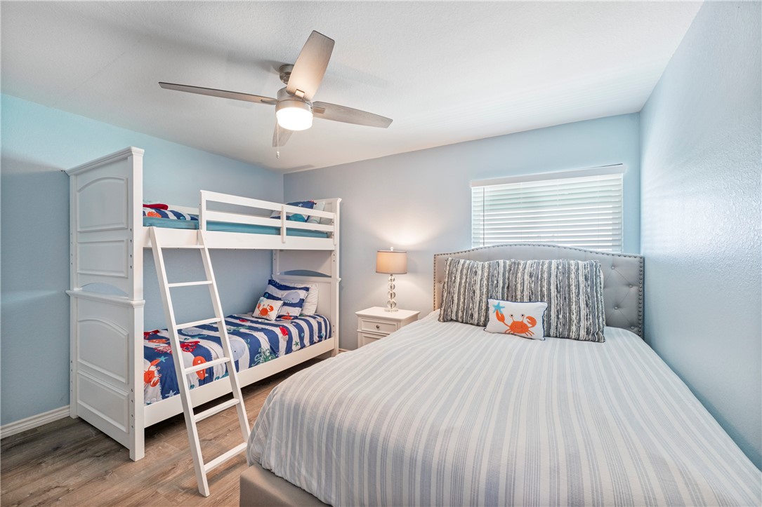 800 Beach Access Road Port Aransas, TX 78373 - Photo 5 of 13 a bedroom with bed and a window