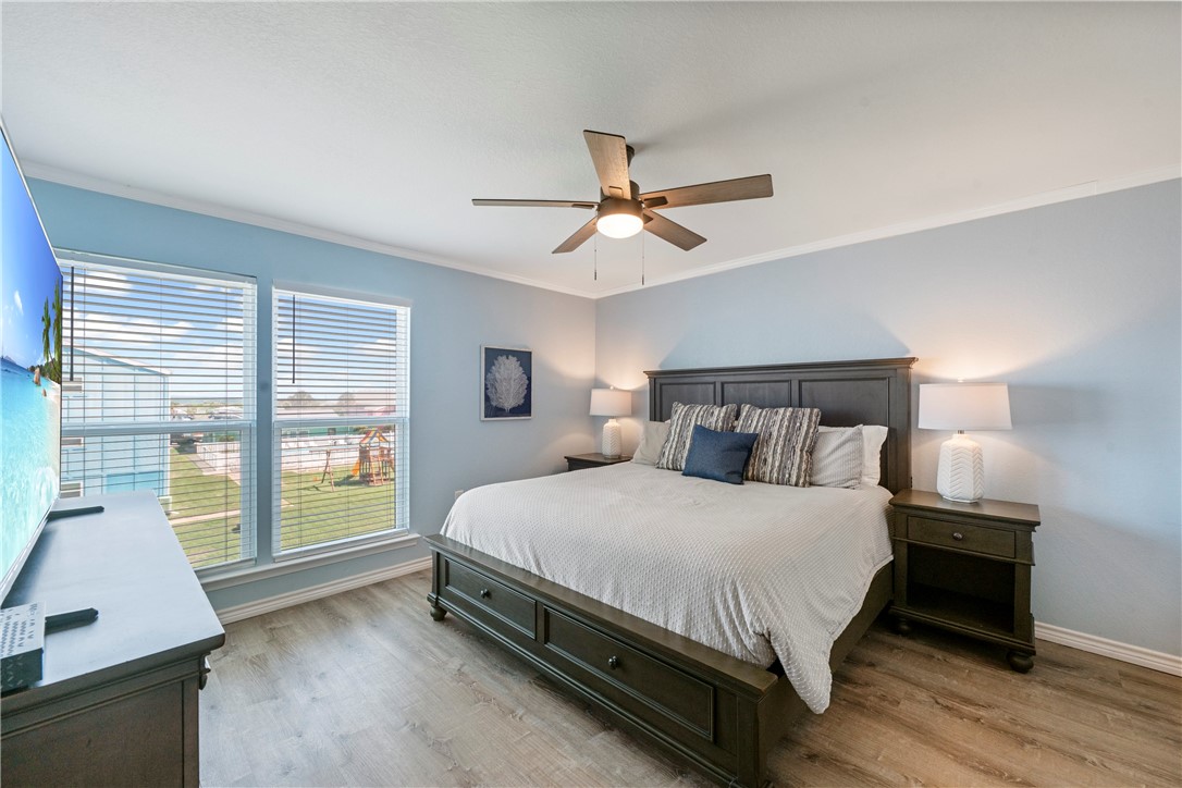800 Beach Access Road Port Aransas, TX 78373 - Photo 7 of 13 a bedroom with a large bed and a window