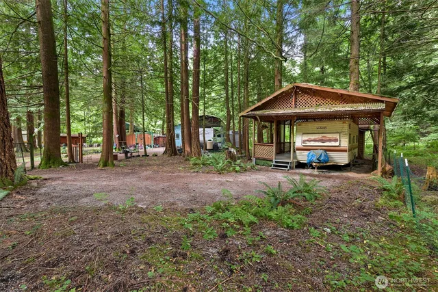 a car parked in front of a house and trees
