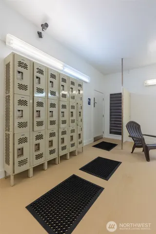 a bathroom with a glass shower door