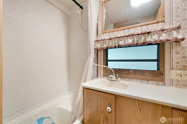 a bathroom with a sink and a mirror