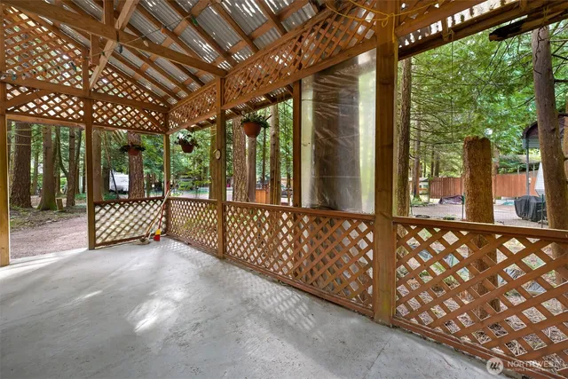 a view of a porch with wooden fence