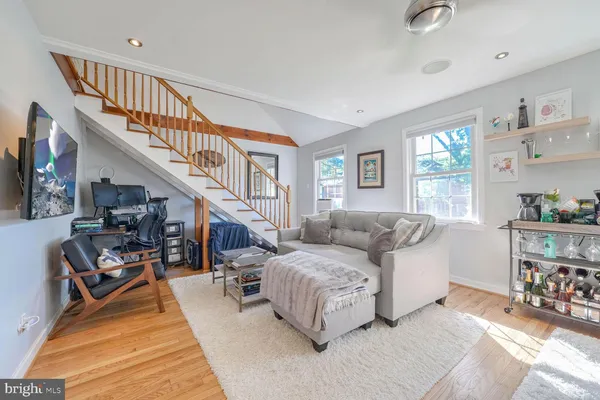 a living room with furniture and a rug