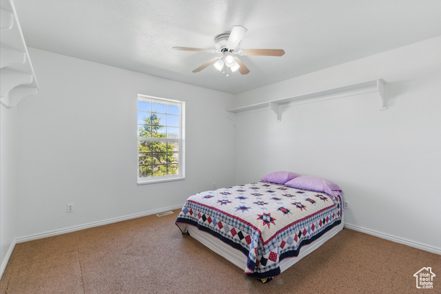 151 South Haulage Road Eureka, UT 84628 - Photo 25 of 36 Carpeted bedroom with ceiling fan and baseboards