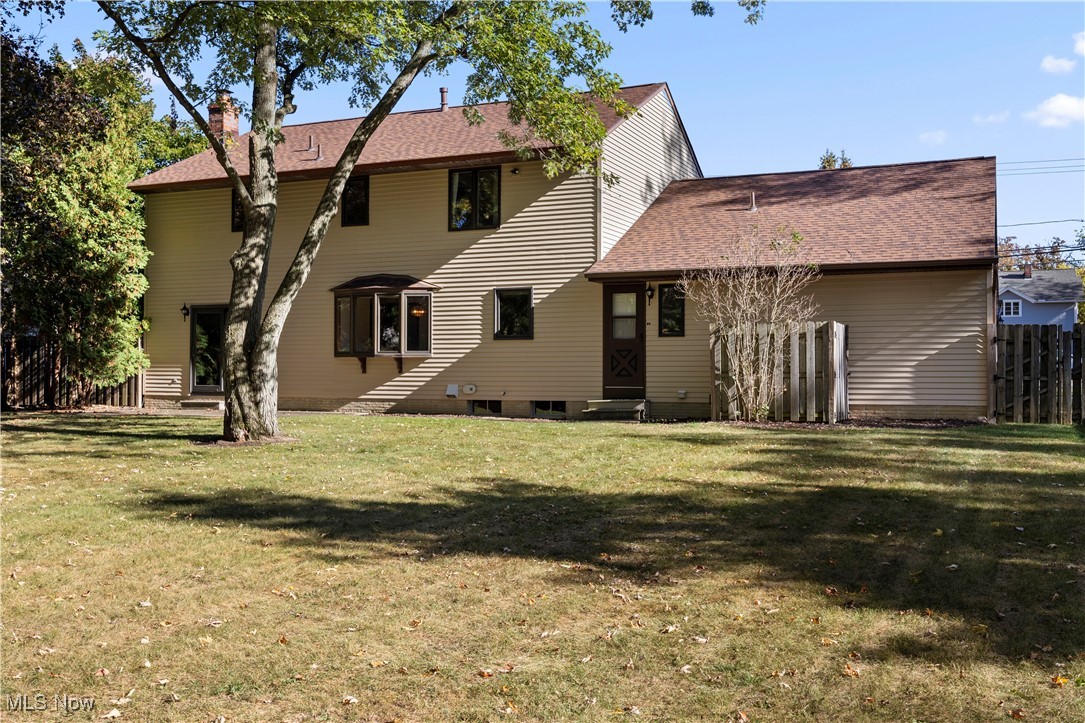 1711 Gulf Road Elyria, OH 44035 - Photo 43 of 50 Rear view of property featuring a chimney and a shingled roof