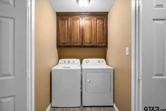 a utility room with dryer and washer