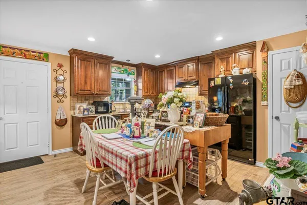 a view of a dining room with furniture window and outdoor kitchen