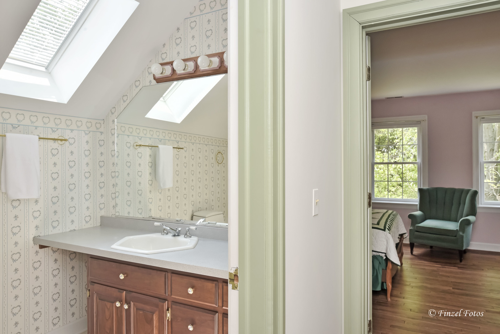 3816 Deep Cut Road Woodstock, IL 60098 - Photo 18 of 32 a bathroom with a granite countertop sink and a mirror